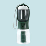 Green and clear portable pet water bottle with a strap on a white background