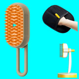 Pet grooming brush with orange bristles, black massage pad, and packaging on a white background.