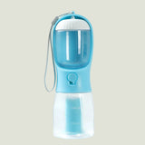 Blue and clear portable pet water bottle with a strap on a white background