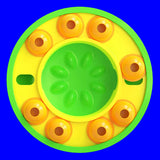 Round yellow and green toy with orange circular elements on a white background
