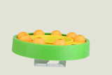 Green and yellow puzzle toy on a white background