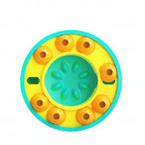 Colorful circular toy with yellow center and orange rings on a white background