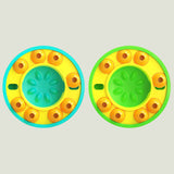 Two colorful circular toys with a central green circle and orange accents on a white background.