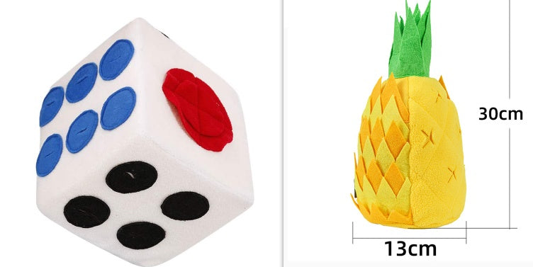 White die with blue, black, and red faces next to a yellow pineapple plush toy with dimensions.