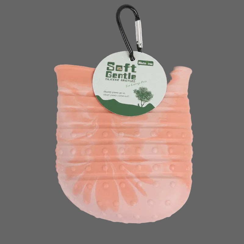 Pink textured dog toy with a carabiner and label on a white background
