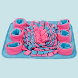Pink and blue pet mat with rolled-up padding on a white background